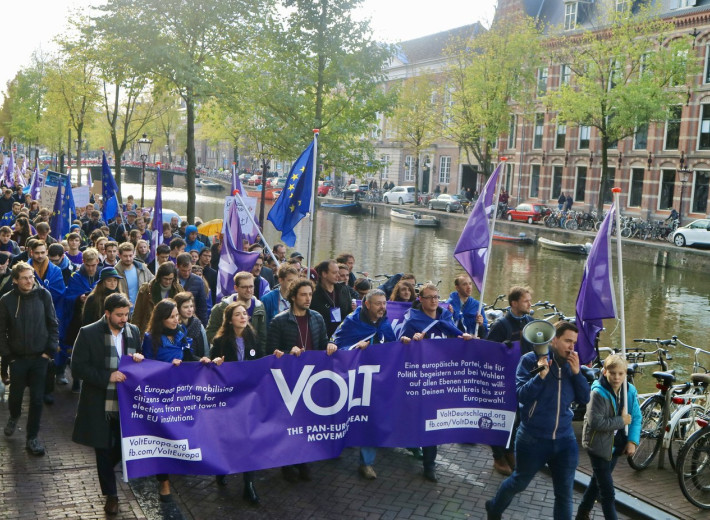 Volt parade in Amsterdam with flag